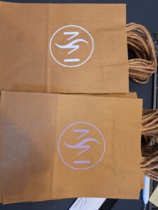 Papiersackerl, Papiertüte mit Firmenlogo